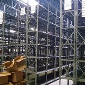 Used steel shelving 24" deep x 36" wide standing in warehouse