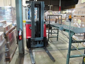 Traditional forklift in a distribution center.