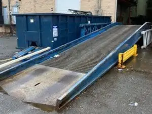 Used Bluff Manufacturing yard ramp shown at loading dock
