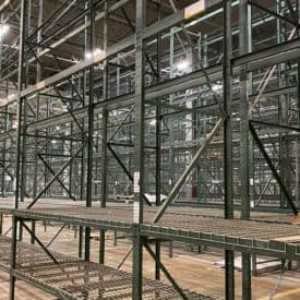 Green structural pallet racking installed in warehouse