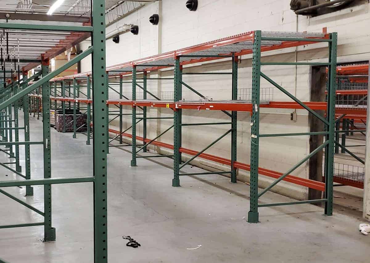Side angle of teardrop pallet rack installed in warehouse